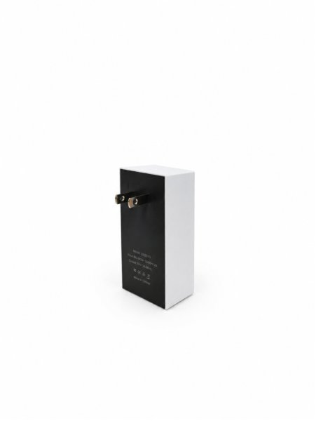 Starlink mini power supply adapter on a neutral surface